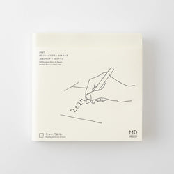 A square cream-colored notebook or planner cover with minimalist black line art of a hand writing '2027' and small printed text, shown against a light gray background.