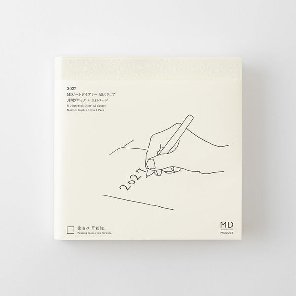A square cream-colored notebook or planner cover with minimalist black line art of a hand writing '2027' and small printed text, shown against a light gray background.