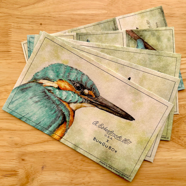 Stack of cards with a bird illustration on a wooden surface