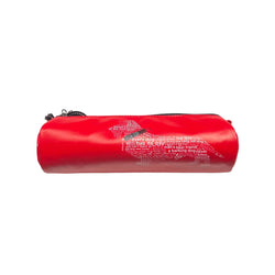 Red cylindrical pouch with text on a white box against a white surface
