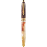 Pen with gold accents on a white background