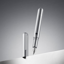 Silver fountain pen on a gray background