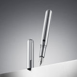 Silver fountain pen on a gray background