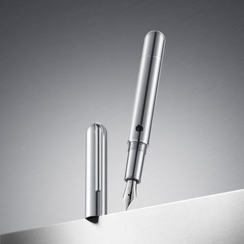 Silver fountain pen on a gray background