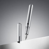 Silver fountain pen on a gray background