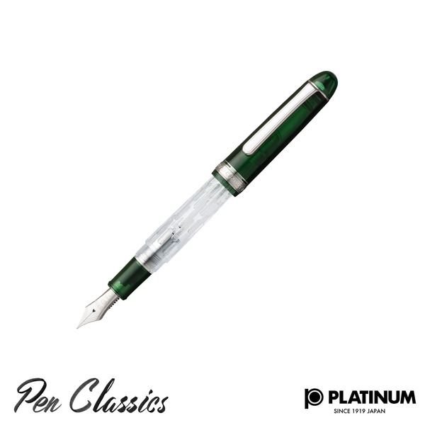 A green and clear Platinum pen with the cap posted to the pen and the nib facing down