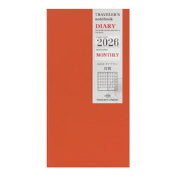 Red diary with a white label displaying '2026' and 'Monthly' on a white background