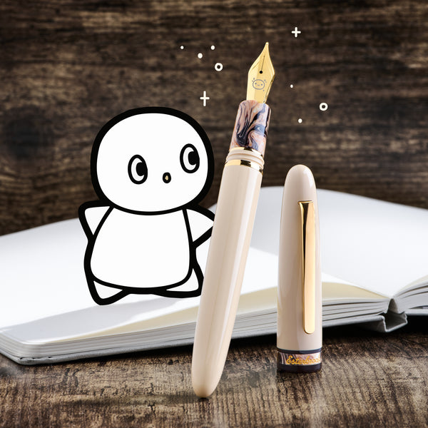 Fountain pen with drawing on a wooden surface with a notebook