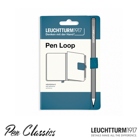 A Leuchtturm Stone Blue coloured pen loop attached to dark blue cardboard packaging